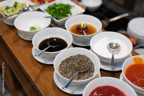 Fototapeta Naklejka Na Ścianę i Meble -  spice background, top view. seasoning in cups. Set of bowls with different spices and herbs, top view. High quality photo