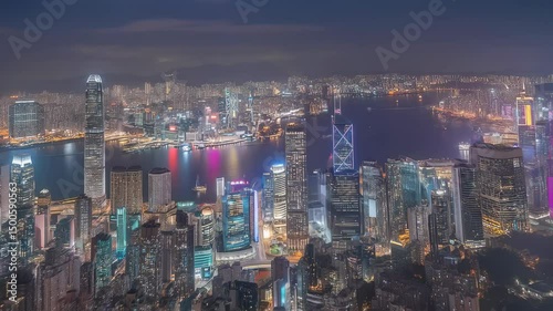 Hong kong skyline with towering skyscrapers and victoria harbour waterfront under dramatic sunset light