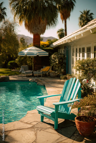 An Outdoor Lounge Chair Beside a Pool in a Resedential Backyard photo