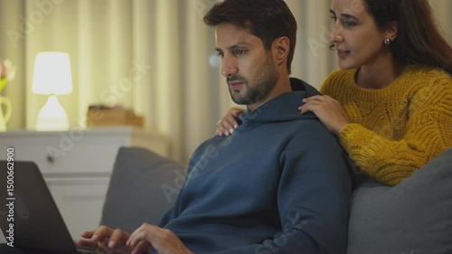 Love & E-Commerce: Couple buying online together. Wireless connection.
