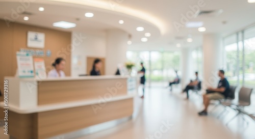 Photo of a Blurred Hospital Reception Area with Patients and Staff Members