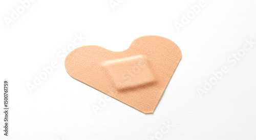 Heart-Shaped Bandage on White Background