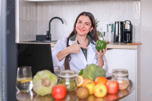 green pepper in hands of Doctor nutritionist, health benefits of eating fresh vegetables. Diet, raw food, eating behavior, vitamins.