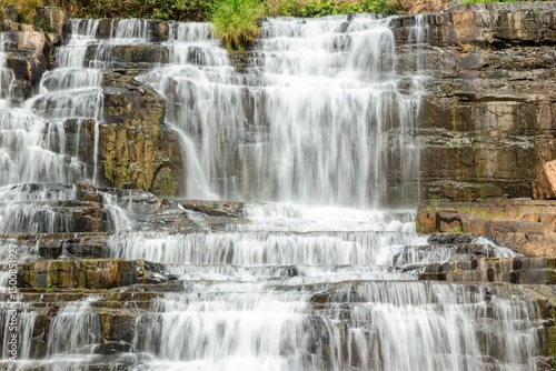 Picturesque Pongour Waterfall Cascading Over Rocky Ledges in a Lush Landscape. Dalat, Vietnam.