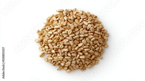Pile of tan hulled seeds on a white surface