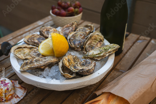 Fresh Raw Oysters with Citron, Baguette, Butter, and Cider