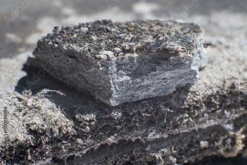 Detailed photography of building material with asbestos fibres. Health harmful and hazards effects.