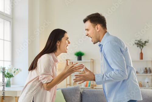 Couple woman and man arguing and shouting at each other, have quarrel and problems in relationship, want to divorce, gesturing angrily, having misunderstanding. Family quarreling concept