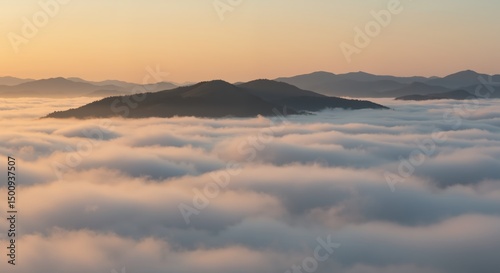 Mountain peak emerging from clouds at sunrise in a serene landscape  