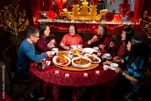 Smiling family enjoying Chinese New Year dinner in restaurant
