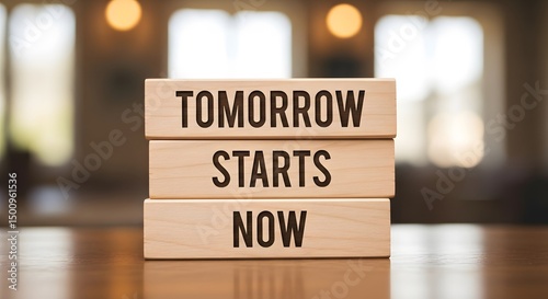 Conceptual image with wooden blocks reading 'Tomorrow Starts Now', inspiring goal setting and progress