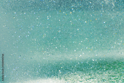 Sparkling water droplets in sunlight creating a magical effect