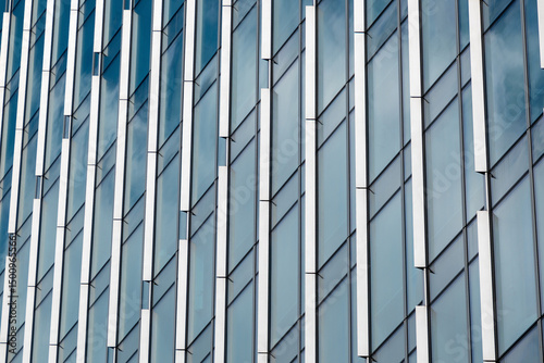 Wallpaper Mural Modern architectural glass facade with geometric reflections and angular design Torontodigital.ca