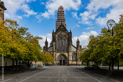 Glasgow cityscape in Scotland, where historic buildings meet modern architecture. The River Clyde flows through the heart of the city, crossed by iconic bridges and surrounded by vibrant urban life.