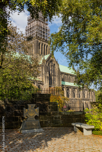Glasgow cityscape in Scotland, where historic buildings meet modern architecture. The River Clyde flows through the heart of the city, crossed by iconic bridges and surrounded by vibrant urban life.