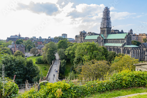 Glasgow cityscape in Scotland, where historic buildings meet modern architecture. The River Clyde flows through the heart of the city, crossed by iconic bridges and surrounded by vibrant urban life.