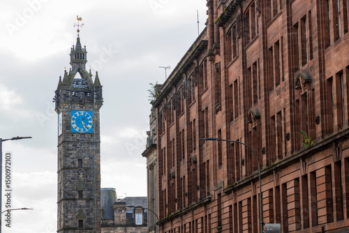 Glasgow cityscape in Scotland, where historic buildings meet modern architecture. The River Clyde flows through the heart of the city, crossed by iconic bridges and surrounded by vibrant urban life.