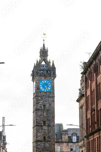 Glasgow cityscape in Scotland, where historic buildings meet modern architecture. The River Clyde flows through the heart of the city, crossed by iconic bridges and surrounded by vibrant urban life.
