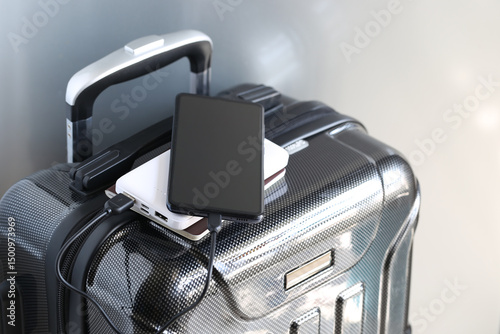 Power bank and passport on luggage for travel of holiday