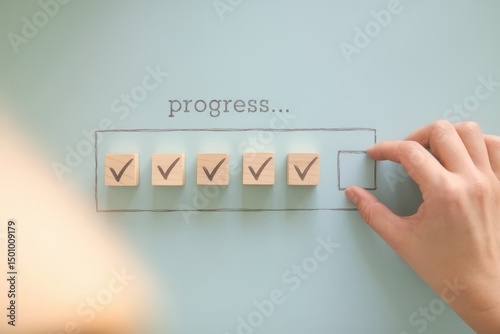 Visual metaphor of progress completion with wooden blocks and checkmarks