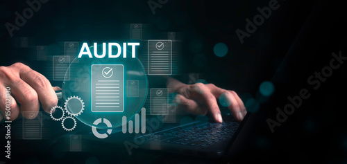 Businessman using laptop and holding magnifying glass to check and evaluate financial statement. Internal auditing of financial accounts. Auditing and fraud investigation. Business audit concept.
