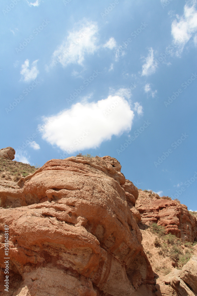 Fototapeta premium View of Pingshan Hu Grand Canyon is mainly composed of red gravel, sandstone, mudstone and is the only composite area of Danxia landform and colored hills in China