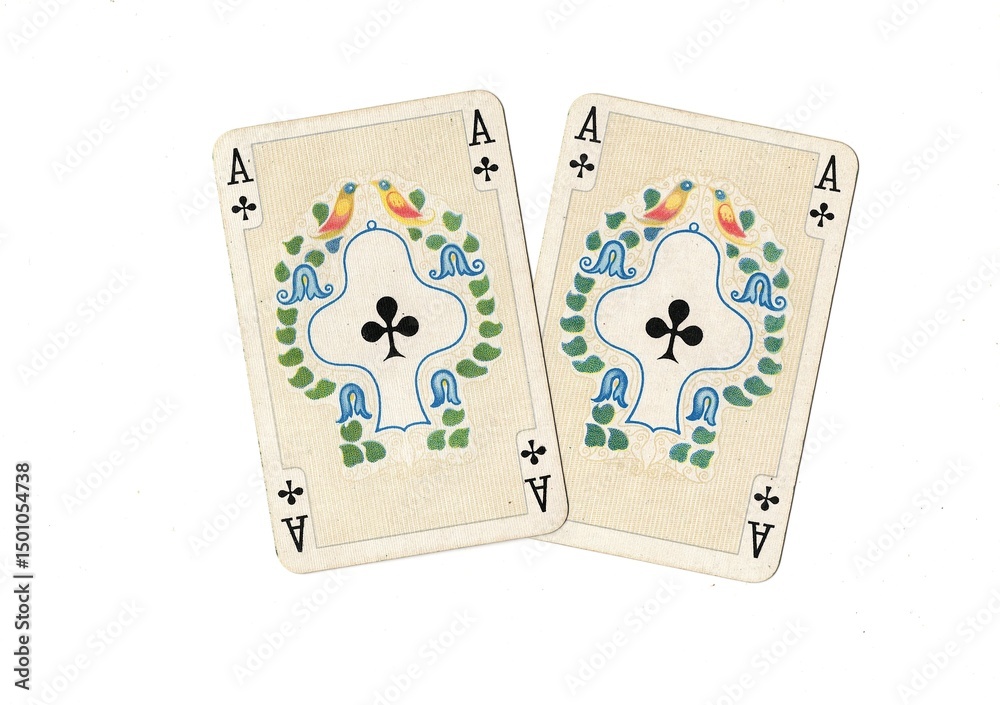 Obraz premium A pair of identical vintage playing cards isolated on a white background.