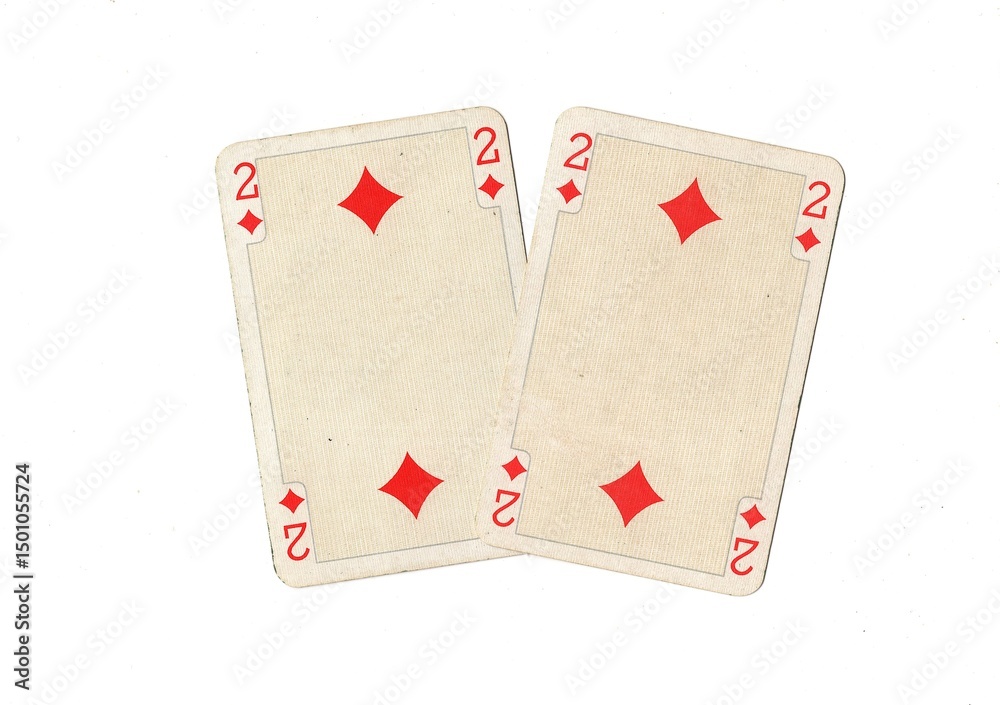 Obraz premium A pair of identical vintage playing cards isolated on a white background.