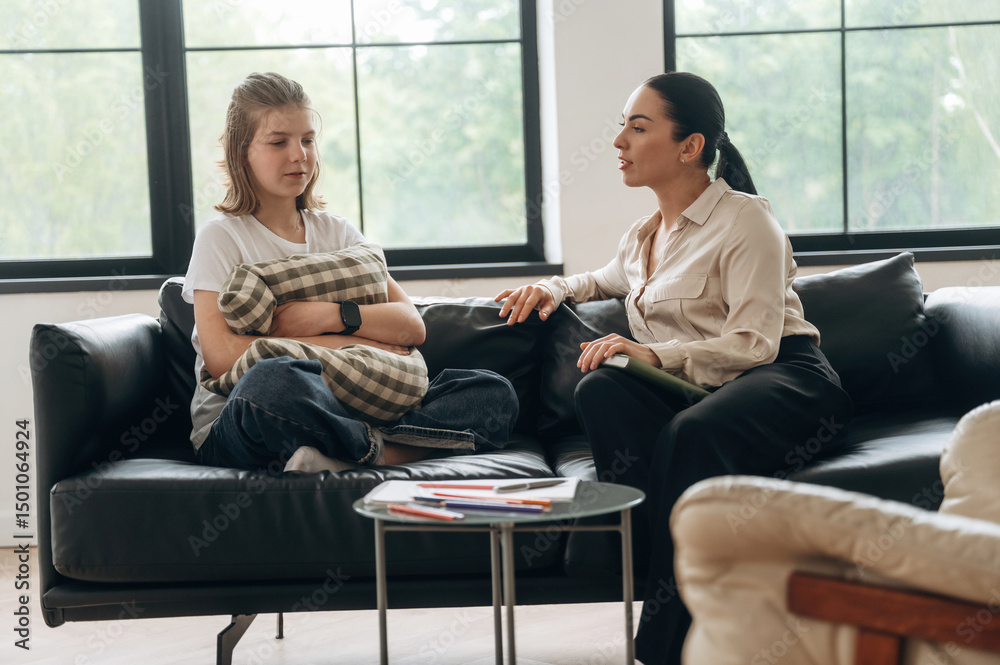 Fototapeta premium Talking about problems. Girl at a psychologist's appointment