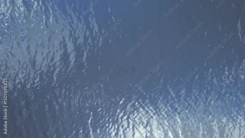 Video documentation of rippled blue surface: abstract and modern texture, light and reflections