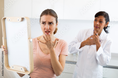 Wallpaper Mural European middle age woman being very surprised and upset after the cosmetic procedure in aesthetic cosmetology clinic Torontodigital.ca