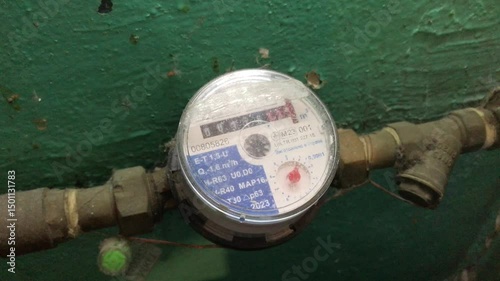 Water meter installation in residential building basement