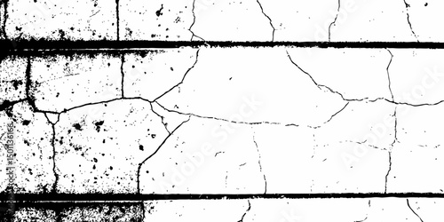 Abstract white brick wall with black grout lines shows a cracked and aged texture, and tear on the surface of the brick pattern	