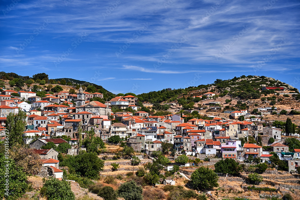 Obraz premium houses and stone orthodox church on hillside on island of Lesbos