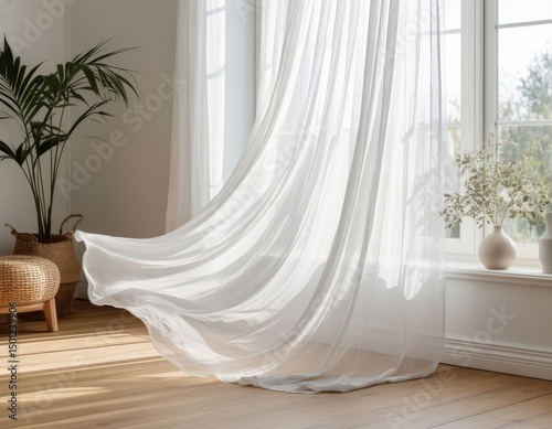 Sheer white curtain moves softly in the wind inside a Scandinavian living room.