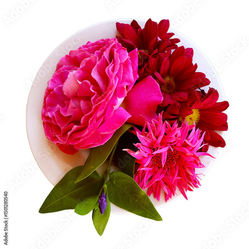 Top view at rose, gerbera and chrysanthemum blossoms in pink and red in a vase on isolated background