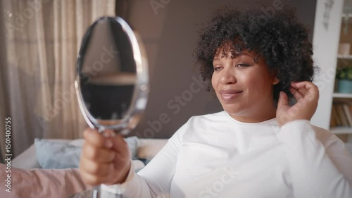 Hormonal changes in pregnancy period, portrait of black woman looking in mirror. Beauty of pregnant lady in third trimester, stay beautiful and healthy, morning beauty routine, dull hair and skin