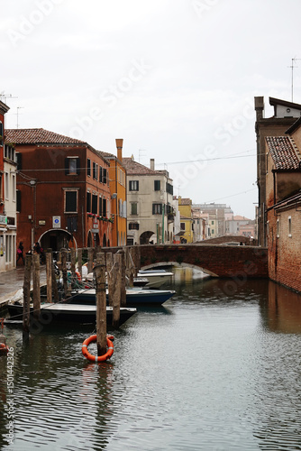 Fototapeta Naklejka Na Ścianę i Meble -  Old canals and streets in Chioggia, Italy	