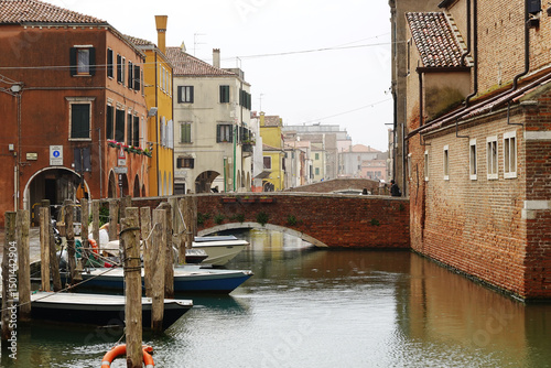 Fototapeta Naklejka Na Ścianę i Meble -  Old canals and streets in Chioggia, Italy	