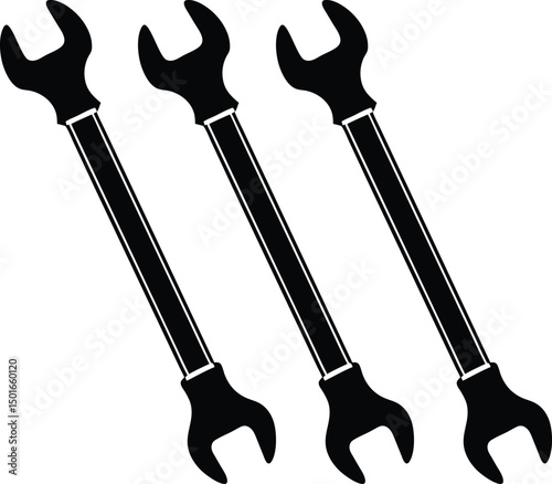 Three black and white open ended wrenches arranged in parallel