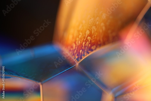 Yellow and blue liquid connection lines, macro view, surreal colours, bright physical effects