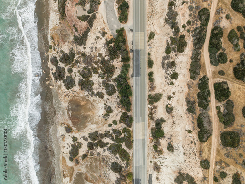 Aerial view of aphrodite beach with serene waves and picturesque coastline, Kouklia, Paphos, Cyprus.