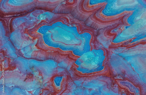 Aerial view of colorful and intricate geological formations with vibrant patterns, Hanksville, Utah, United States.