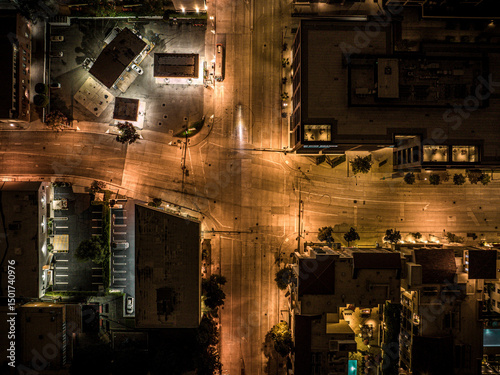 Aerial view of illuminated urban landscape with busy streets and vibrant city lights, Old Pasadena, California, United States.