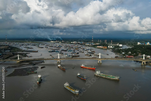 Aerial view of shah amanat bridge over karnafully river with ships, char patharghata, bangladesh.