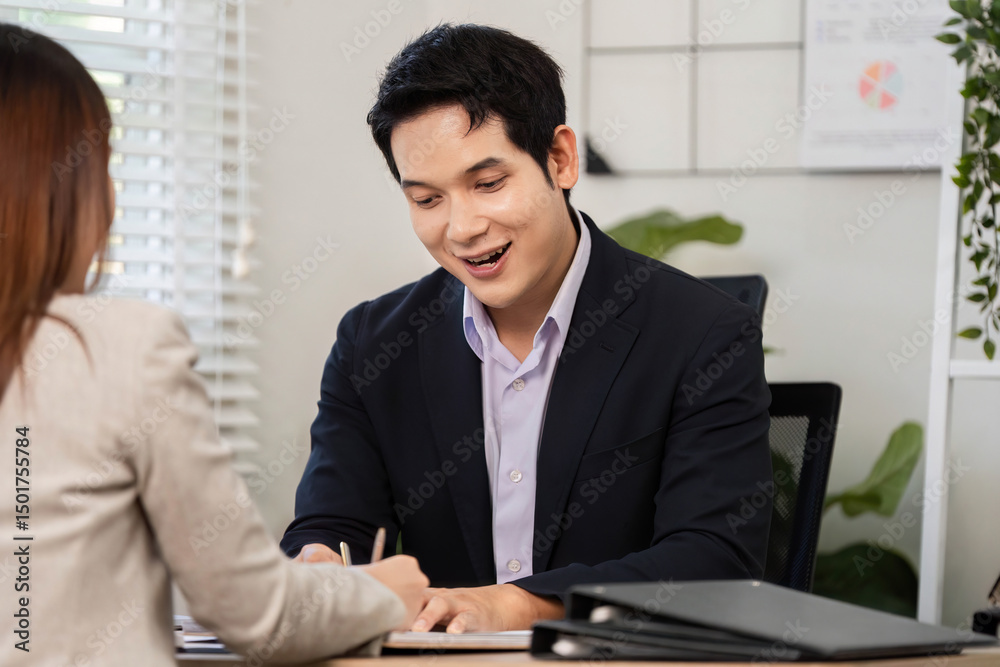 Financial Engagement and Strategy Discussion. Business professional taking notes during a financial meeting. Financial Engagement and Strategy Discussion. Business professional taking notes during a financial meeting.