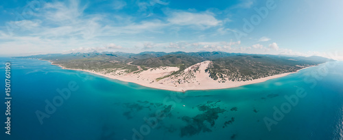 Aerial panoramic view of sand dunes along the coastline at Piscinas Beach, Arbus, Sardinia, Italy.