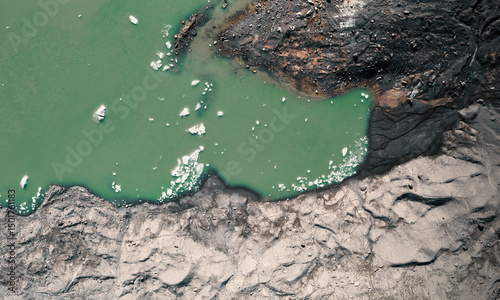 Aerial view of a glacier lake with many floating ice blocks in Chiesa in Valmalenco, Lombardy, Italy. photo