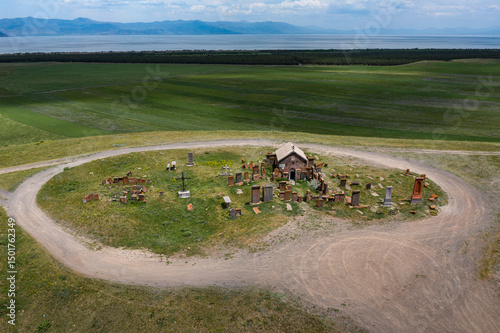Aerial view of a chapel with cemetery near Noratus, Gegharkunik Province, Armenia. photo