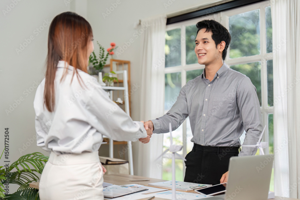 Fototapeta premium ESG Business Collaboration. Professionals shaking hands on a sustainable project.